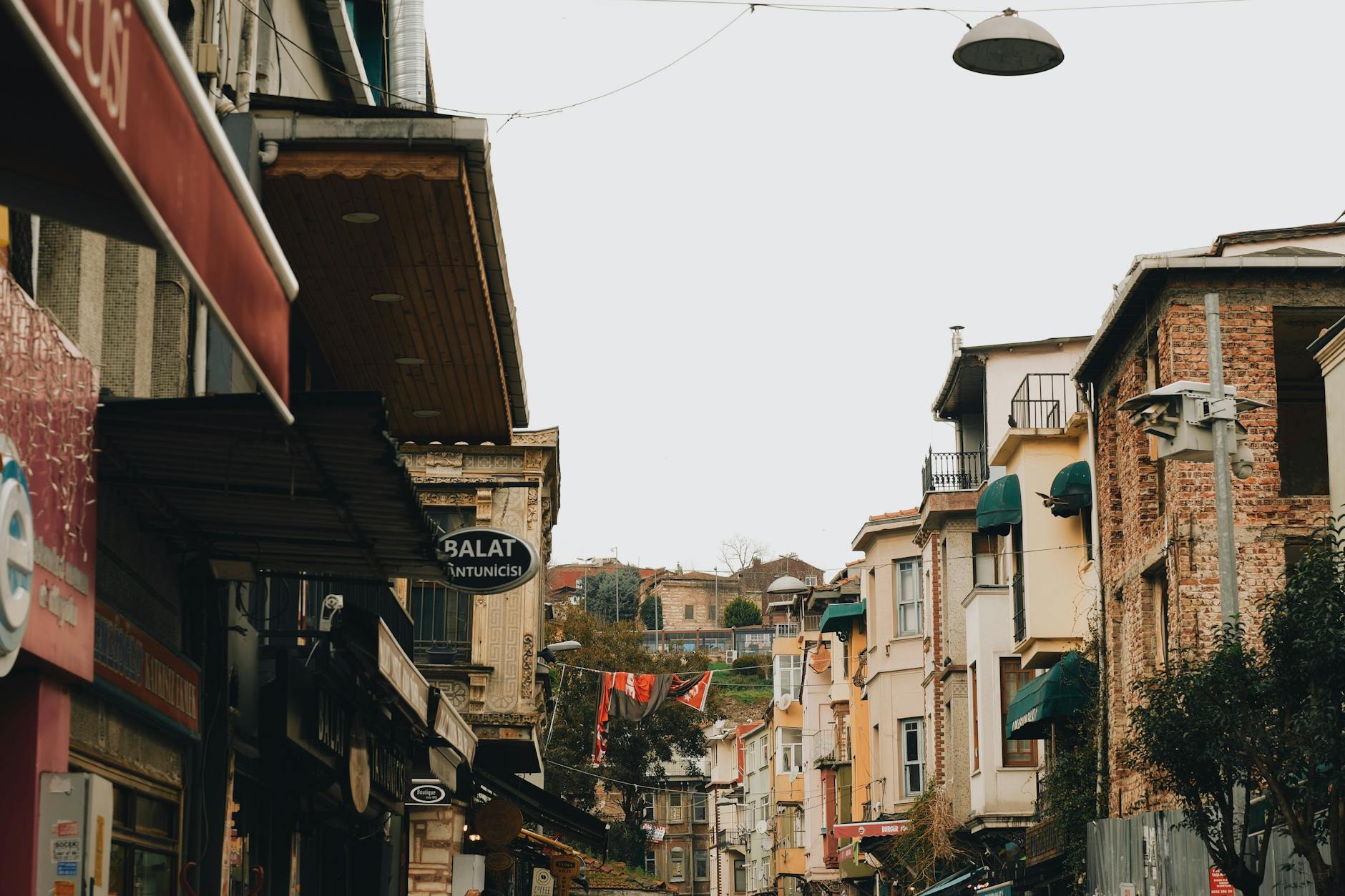A picturesque historic street with colorful buildings symbolizing the local environment and short trips ruled by the 3rd house