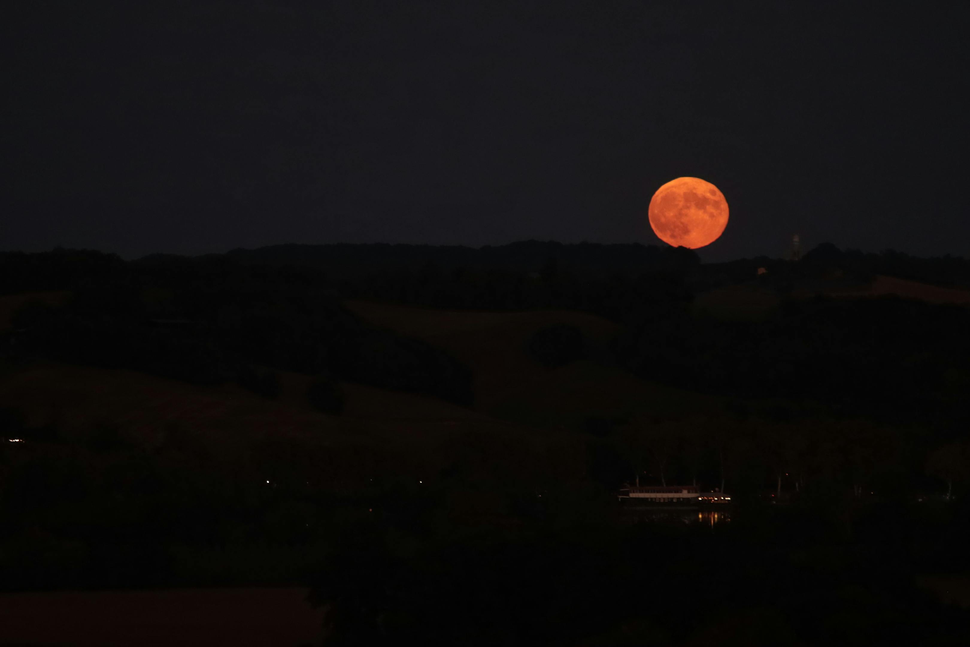 Full moon illuminating a quiet landscape representing the inner life and reflective depths of the 4th house
