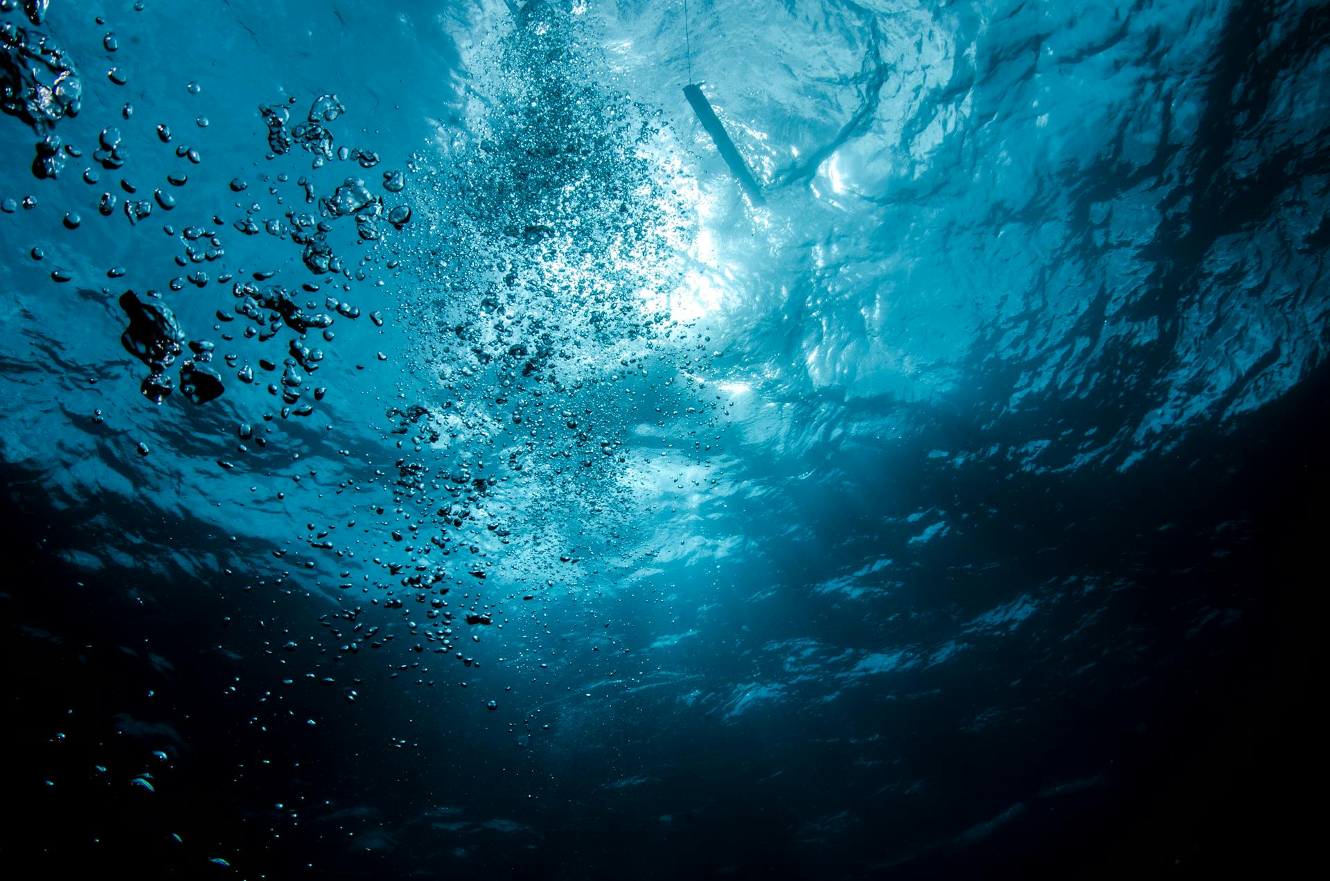 Deep ocean water with light filtering down representing the depths of psychological and emotional territory ruled by the 8th house