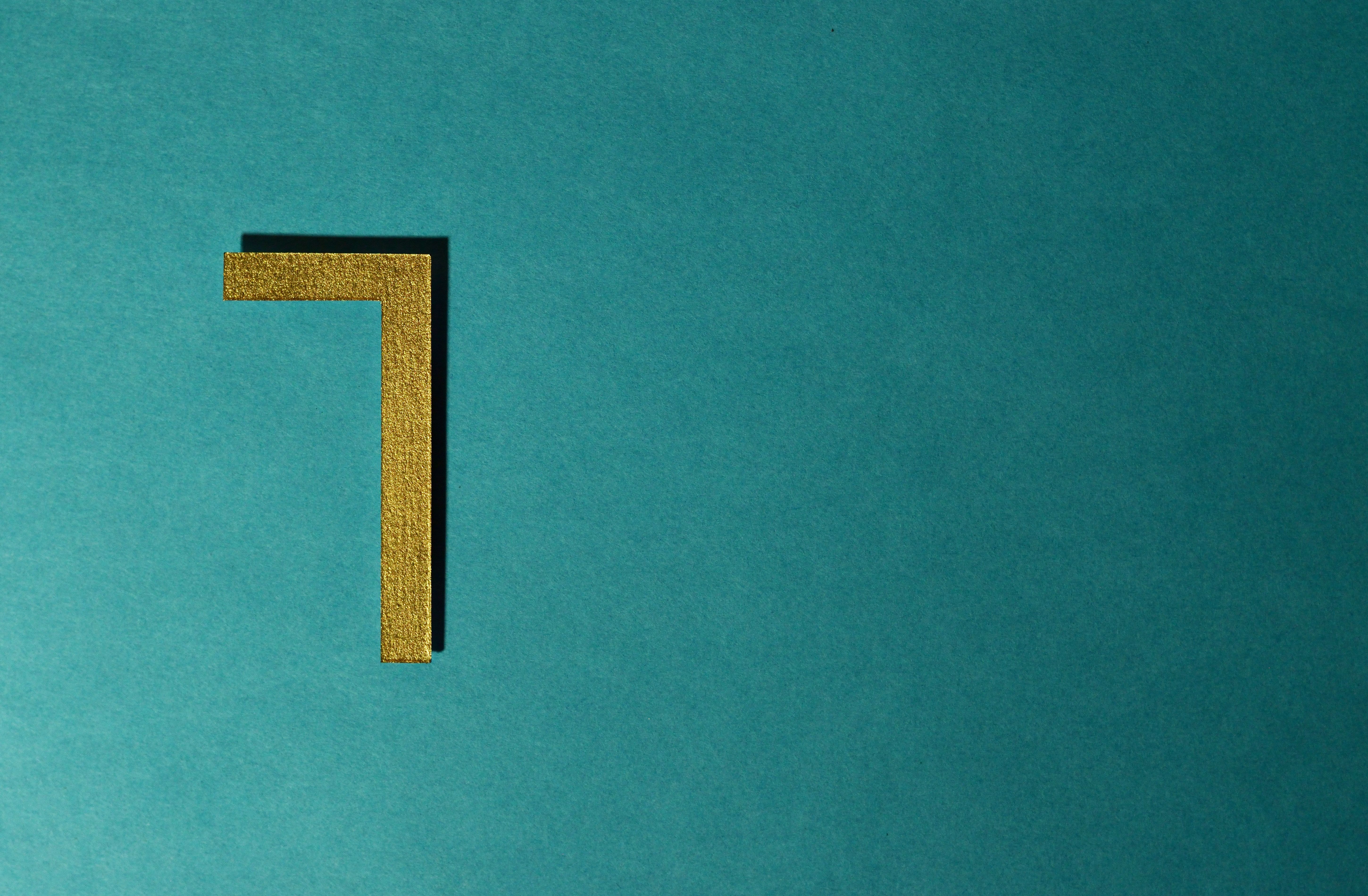 A glowing golden number set against a clean dark background, illustrating the numerology behind angel number 1010