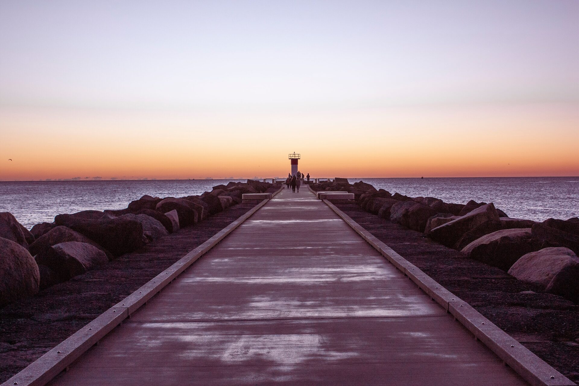 A long path winding toward a bright horizon at sunrise, representing the aligned forward direction linked to angel number 1212