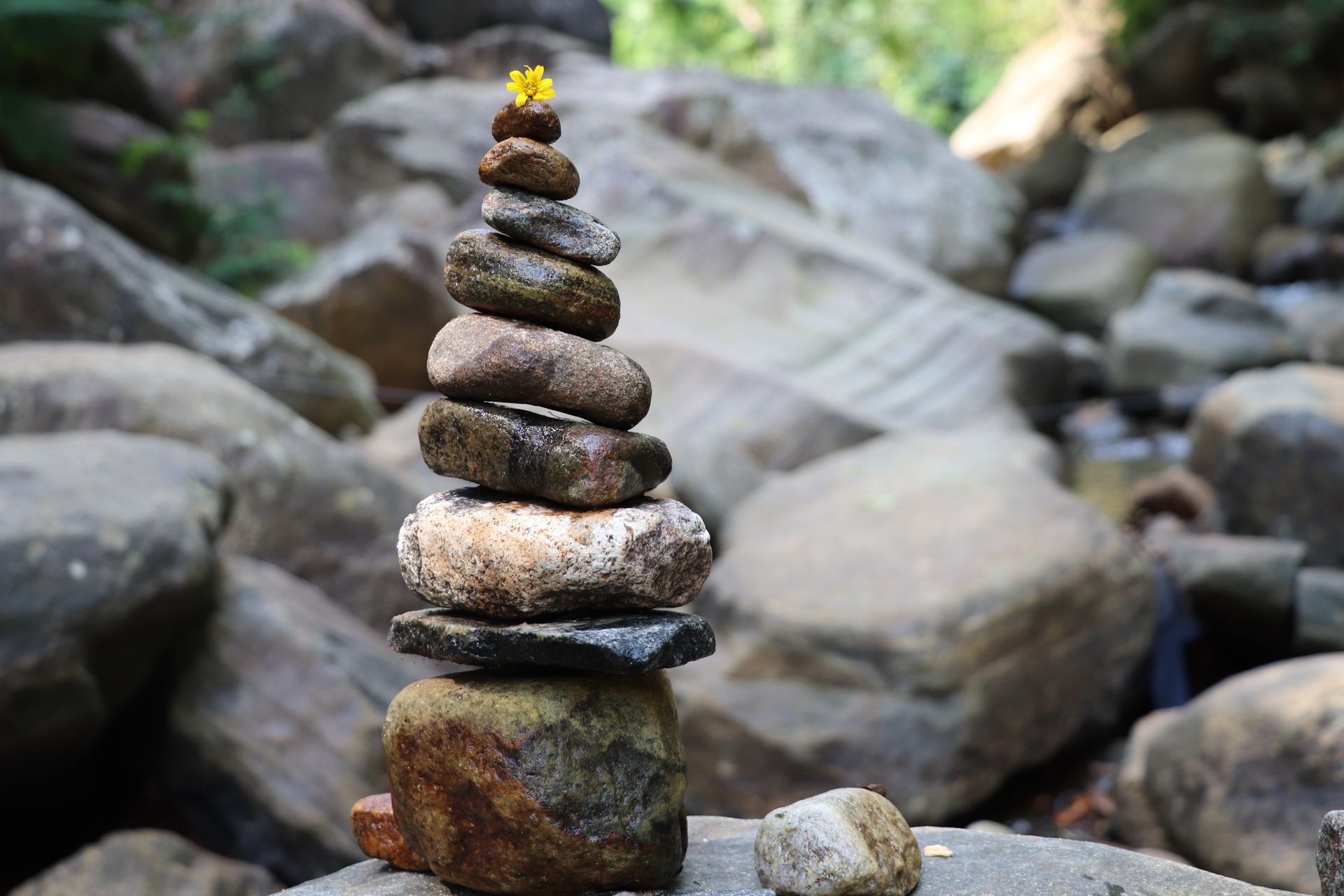Smooth balanced stones stacked in calm light, representing the harmony and equilibrium of the number 2 in numerology