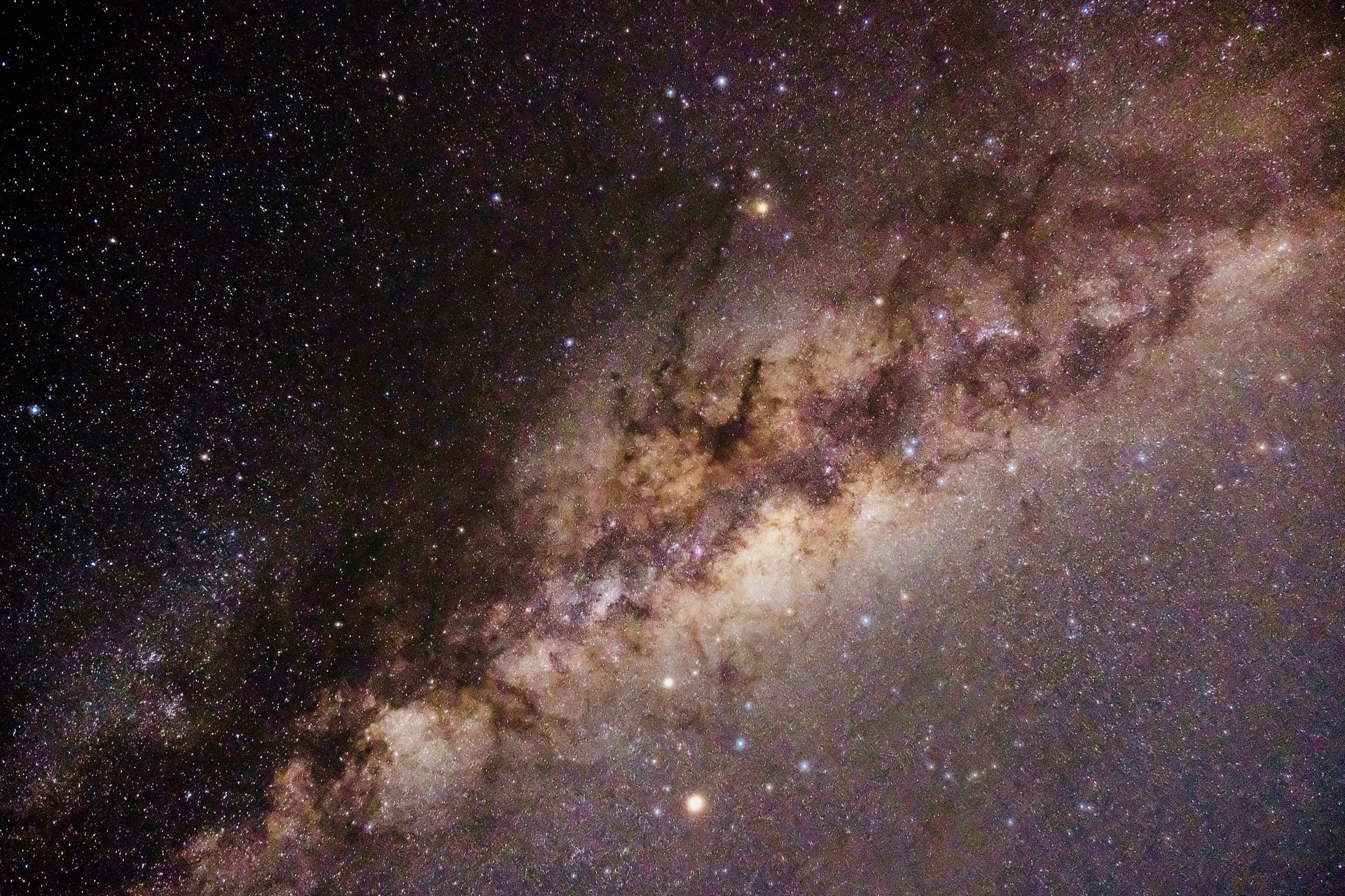 The bright core of the Milky Way arching across a star-filled night sky, representing the calculated points known as Arabic Parts or Lots in astrology