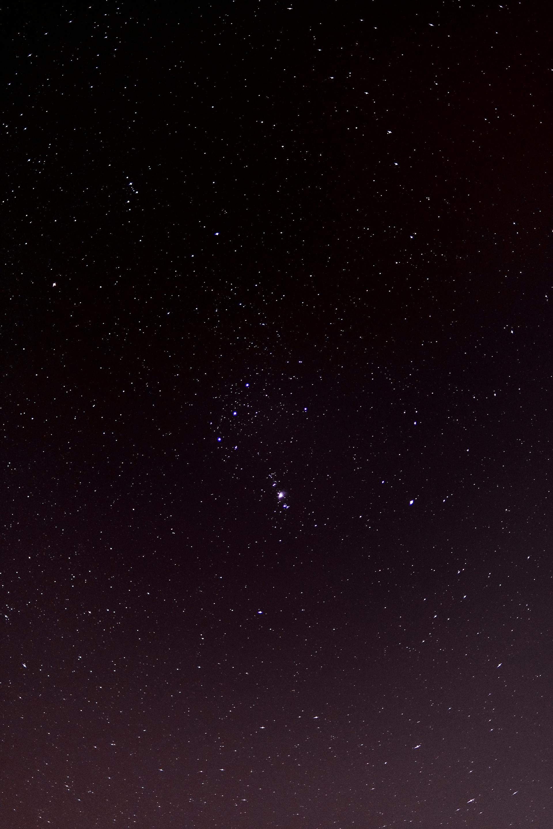 Star constellation patterns against a dark night sky representing the different shapes and patterns visible in astrological birth charts