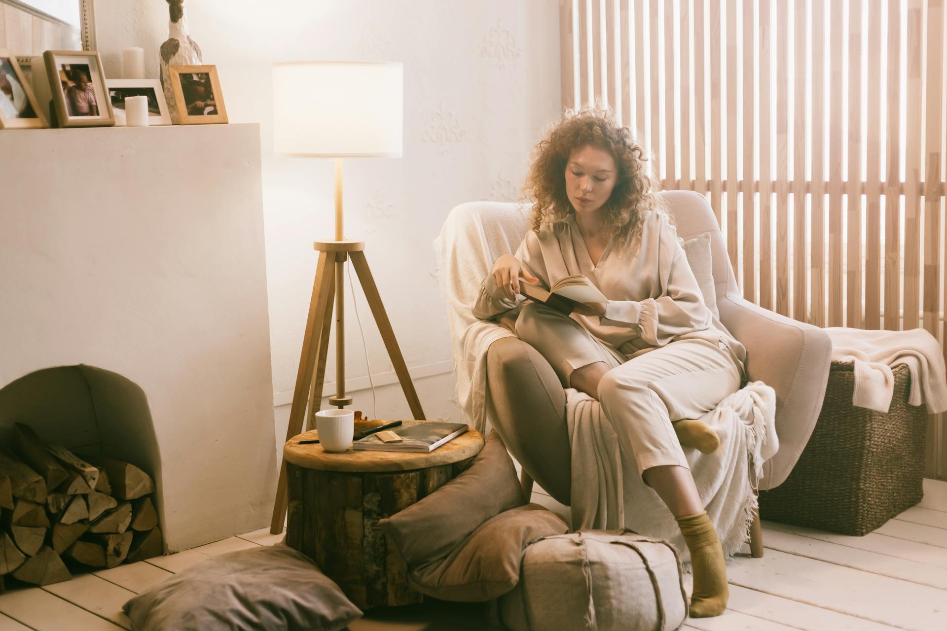A warm, softly lit living room with cozy textures, representing Cancer's deep devotion to home, family, and emotional comfort