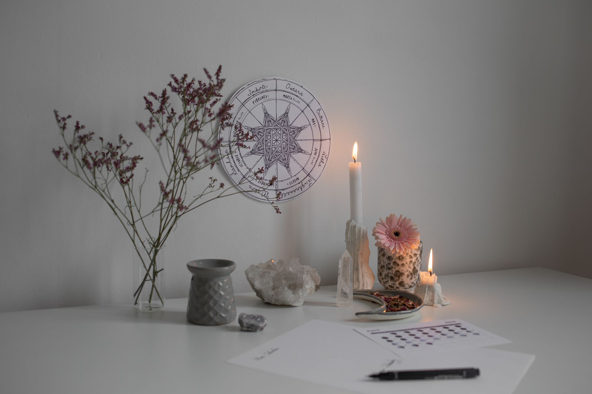 A serene altar setup with candles, crystals, and ritual tools arranged for activating a crystal grid