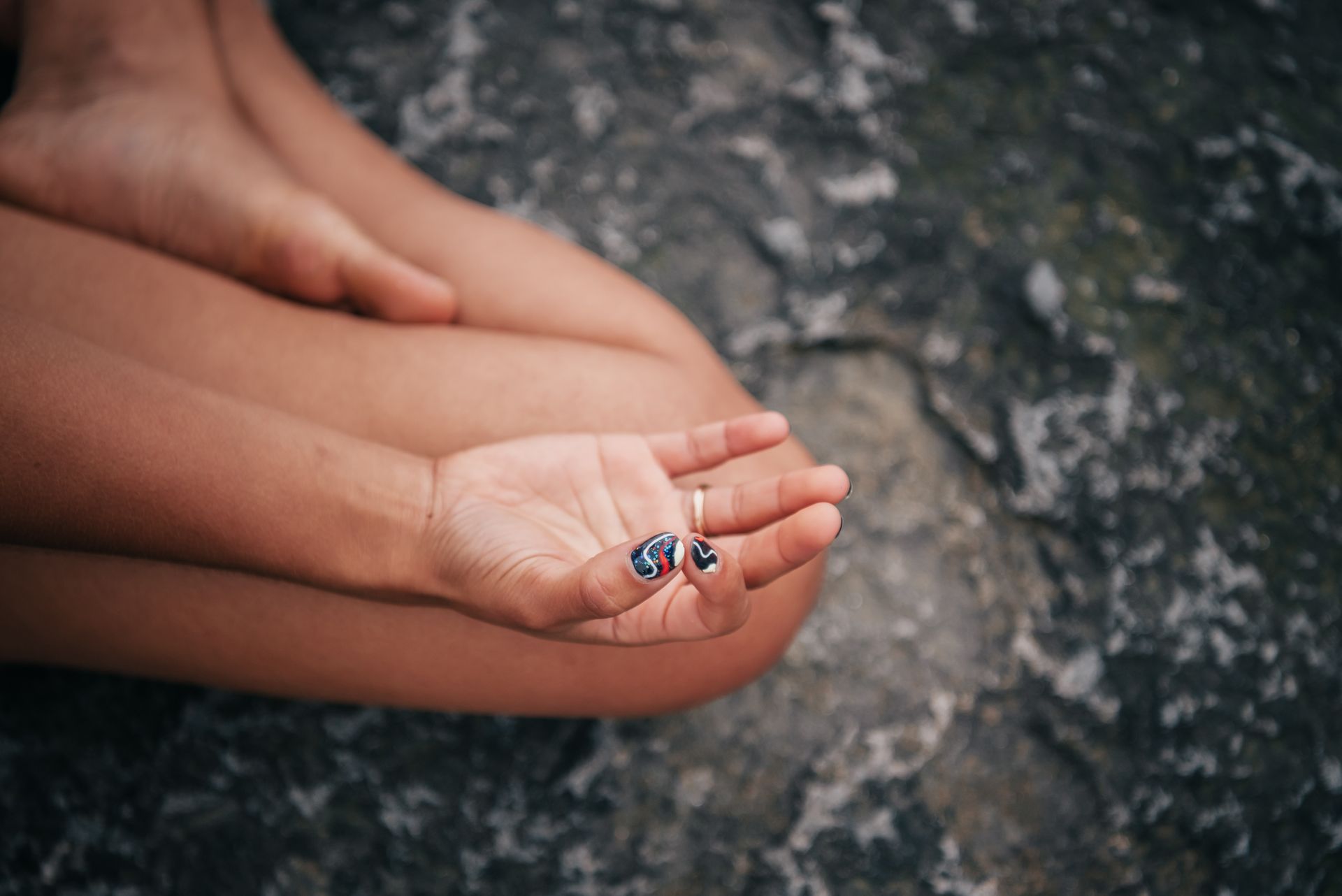 Hands resting in a meditation mudra, representing a steady practice for developing intuition