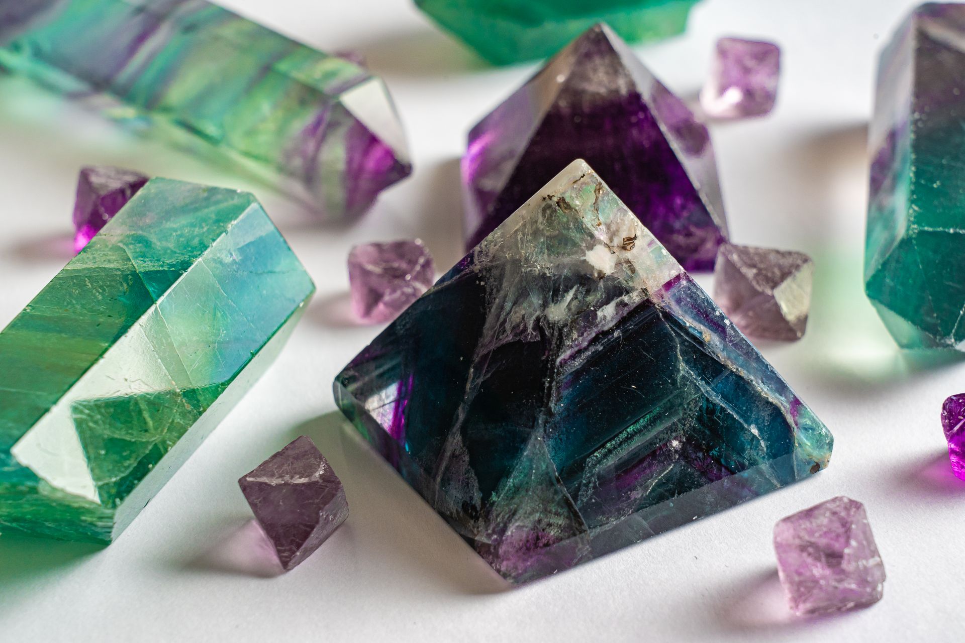 Natural fluorite cubes and clusters showing the mineral's geometric crystal shapes, representing what fluorite is made of