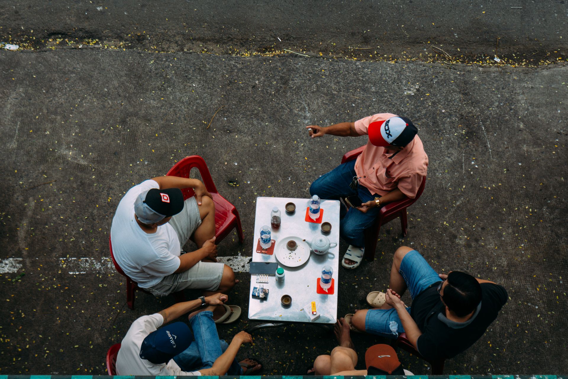A small group of friends laughing together in a bright city setting, reflecting Gemini's social, connection-loving nature