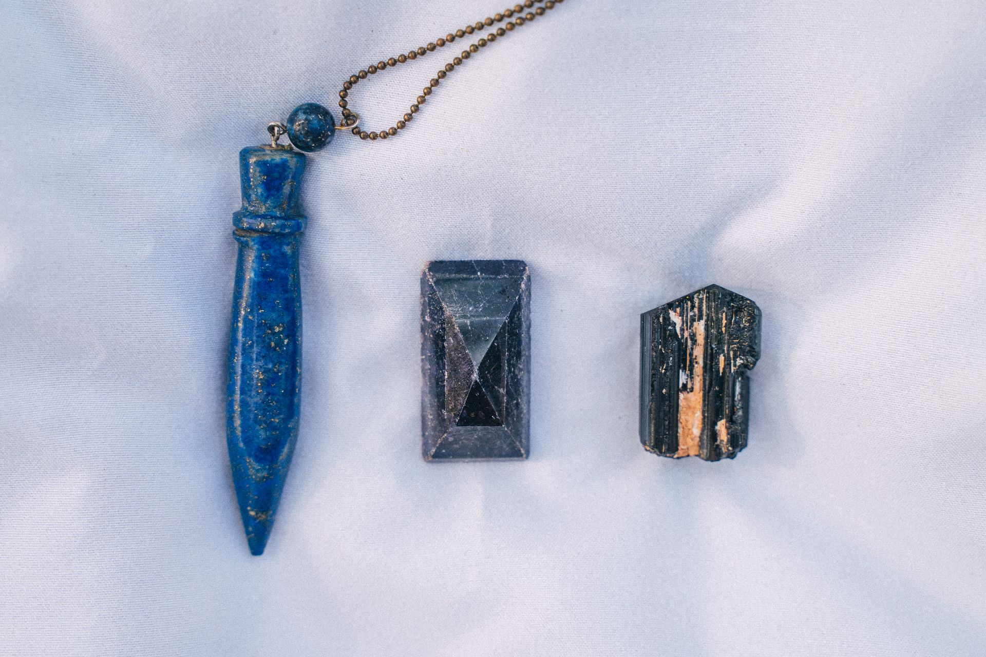 Blue healing crystals arranged in a still life, representing lapis lazuli healing properties and benefits