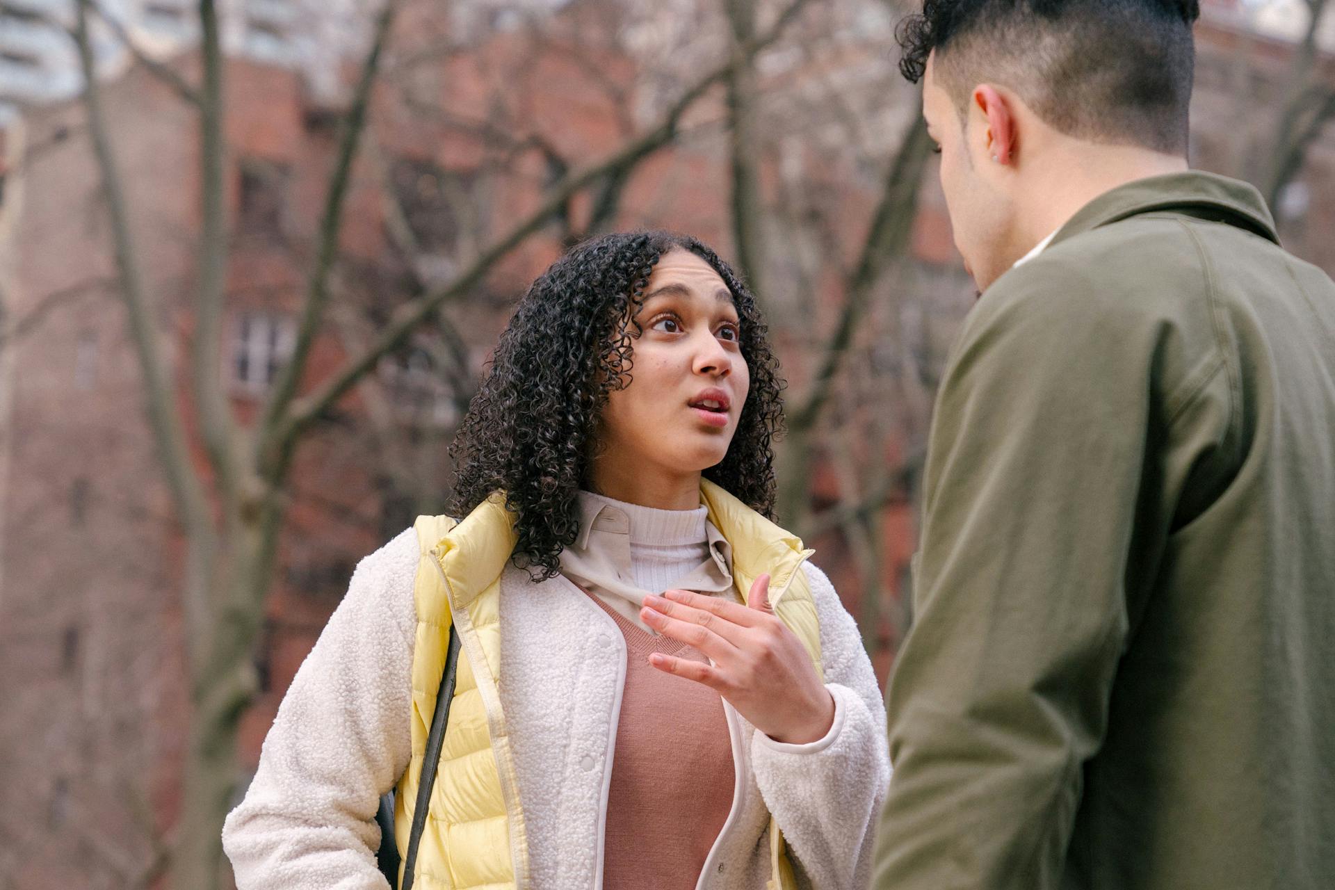 A couple sitting close and talking, representing the daily conversation that Mercury sign compatibility governs in a relationship