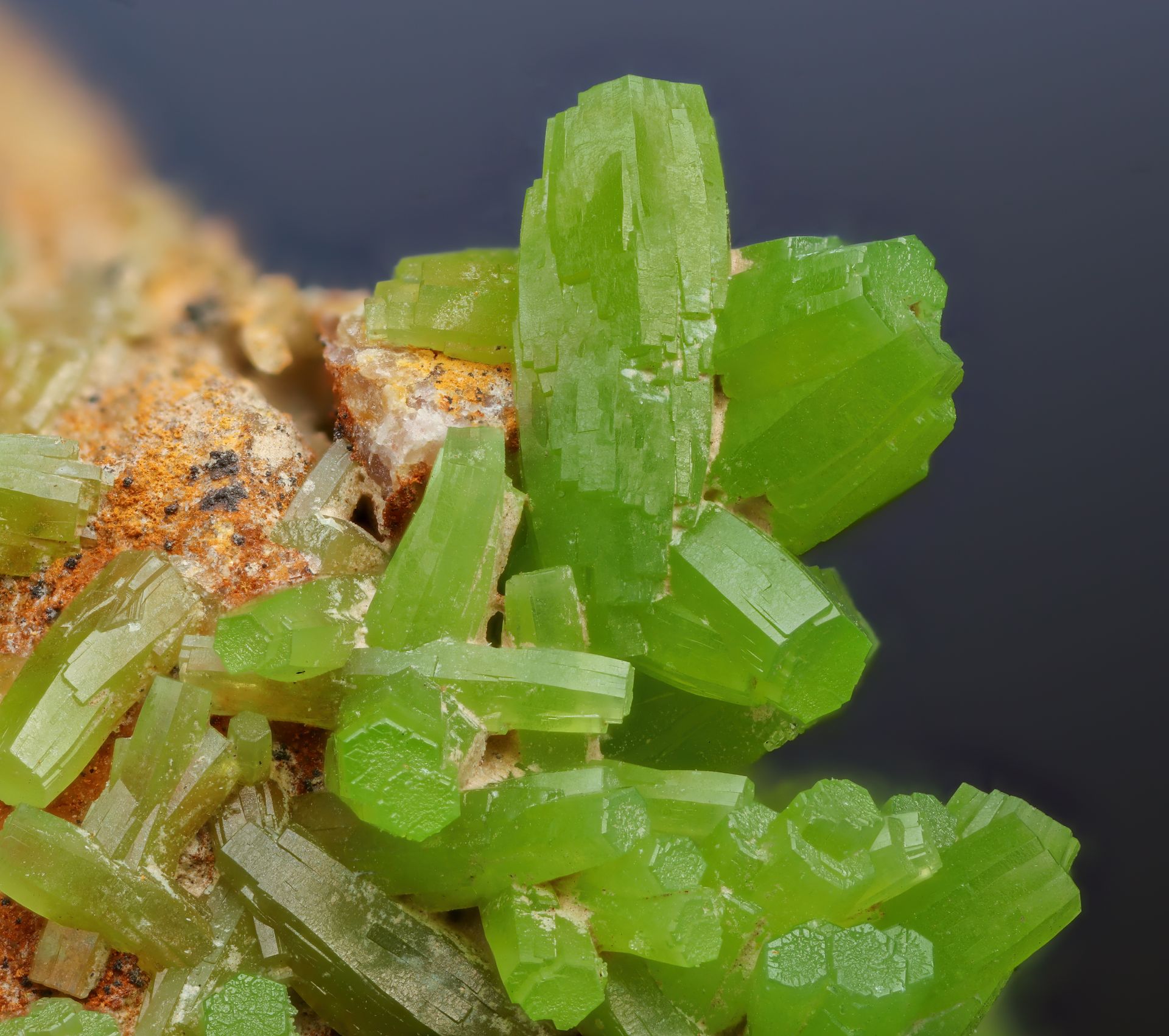 Raw green mineral specimen, representing how to identify authentic moldavite by its natural color and texture