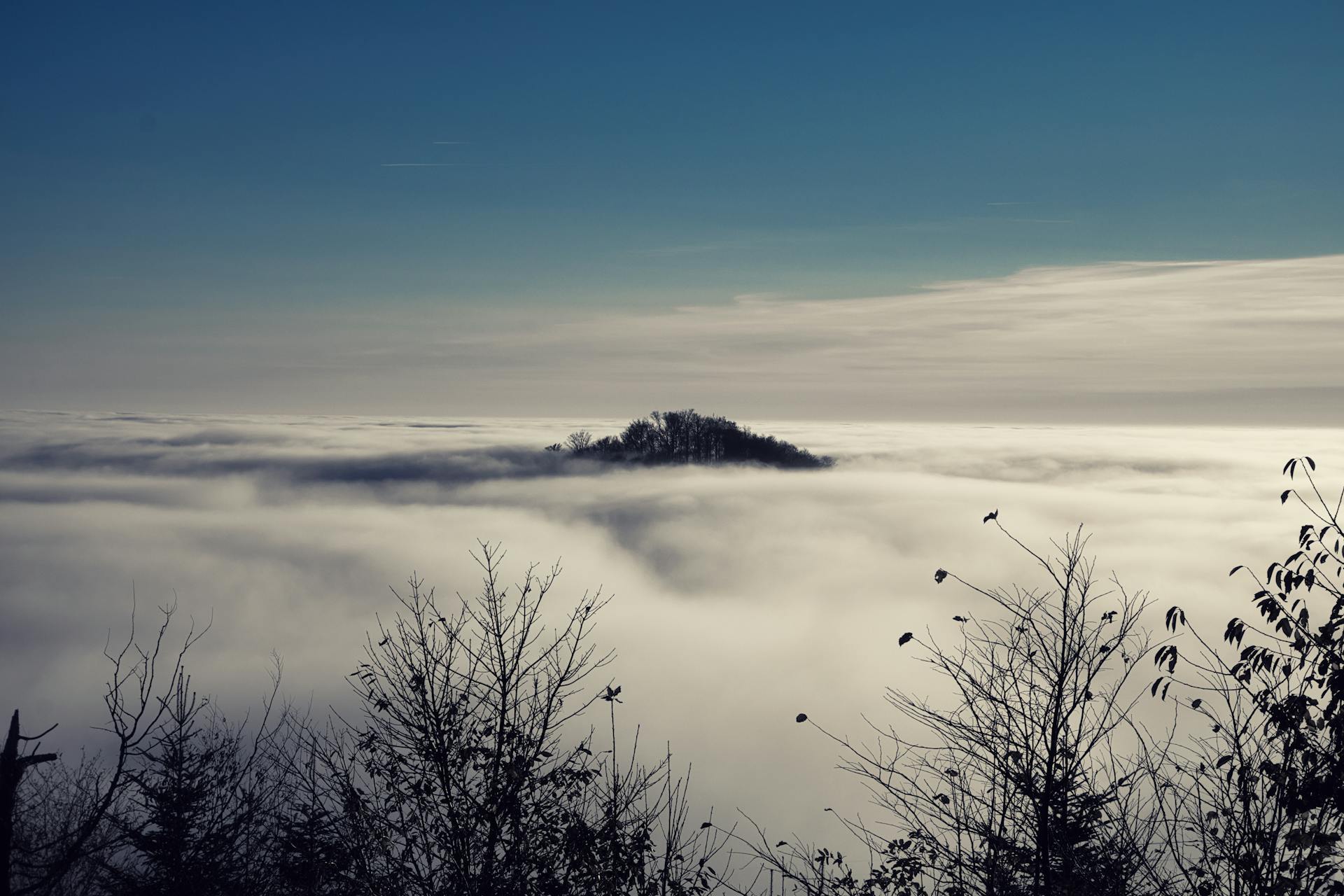 A dreamy blue nebula with soft swirling clouds in deep space representing the mystical and intuitive energy that Neptune brings to the natal chart