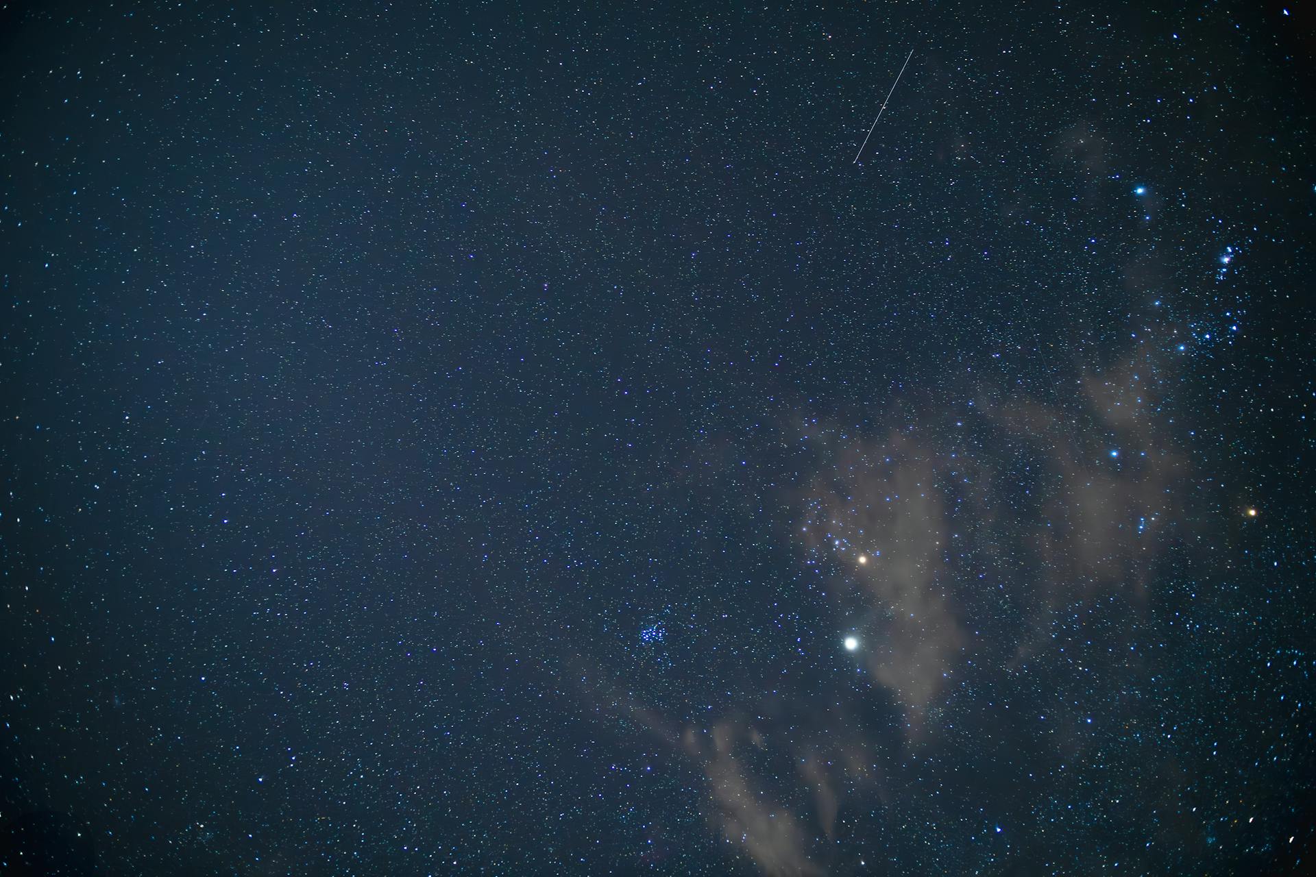 Stars and constellations visible in a clear dark sky representing the cosmic map of purpose and direction that the North Node provides in each house of the natal chart