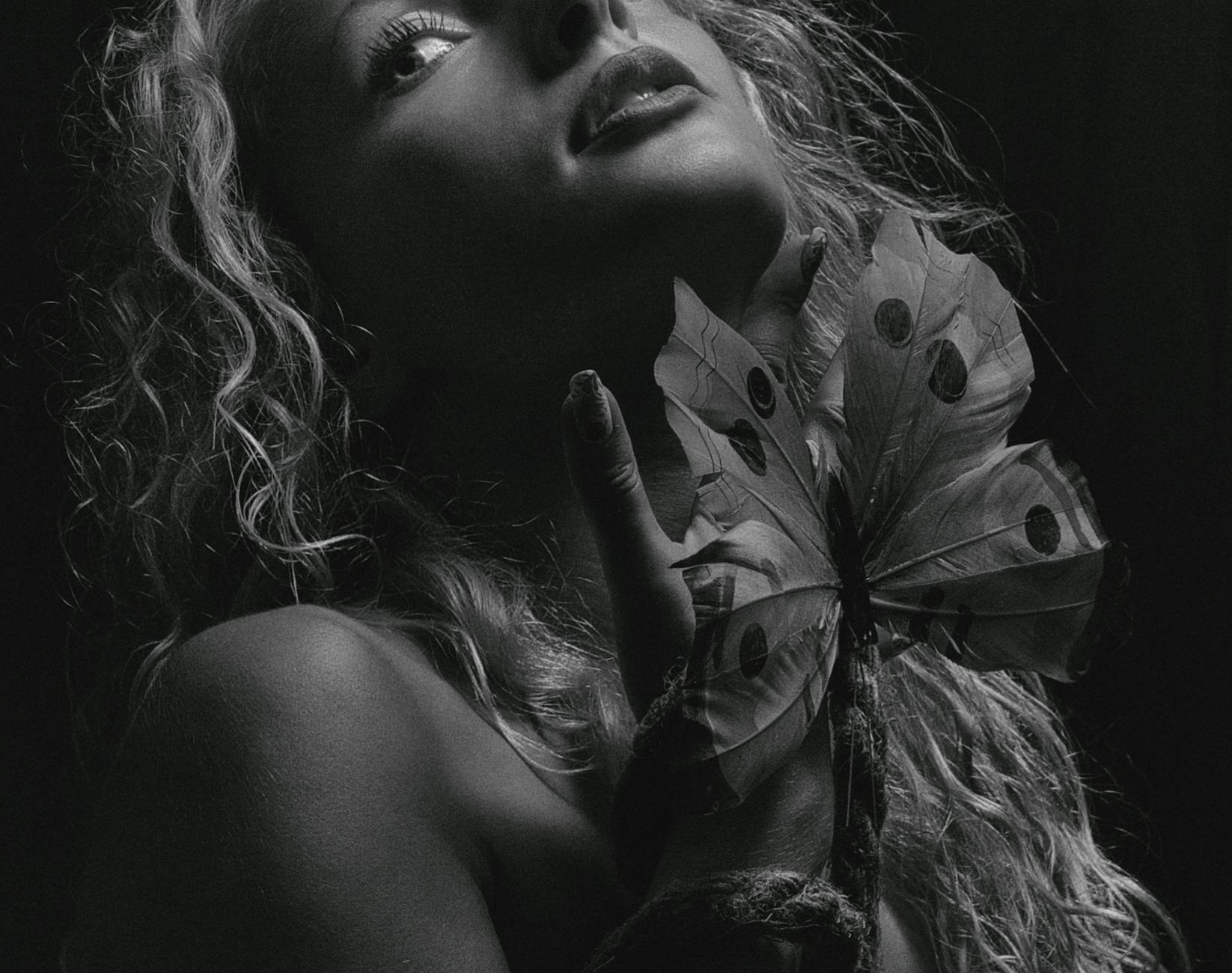 A dreamy ethereal portrait of a woman bathed in soft light symbolizing the soul awareness of the Psyche asteroid in astrology