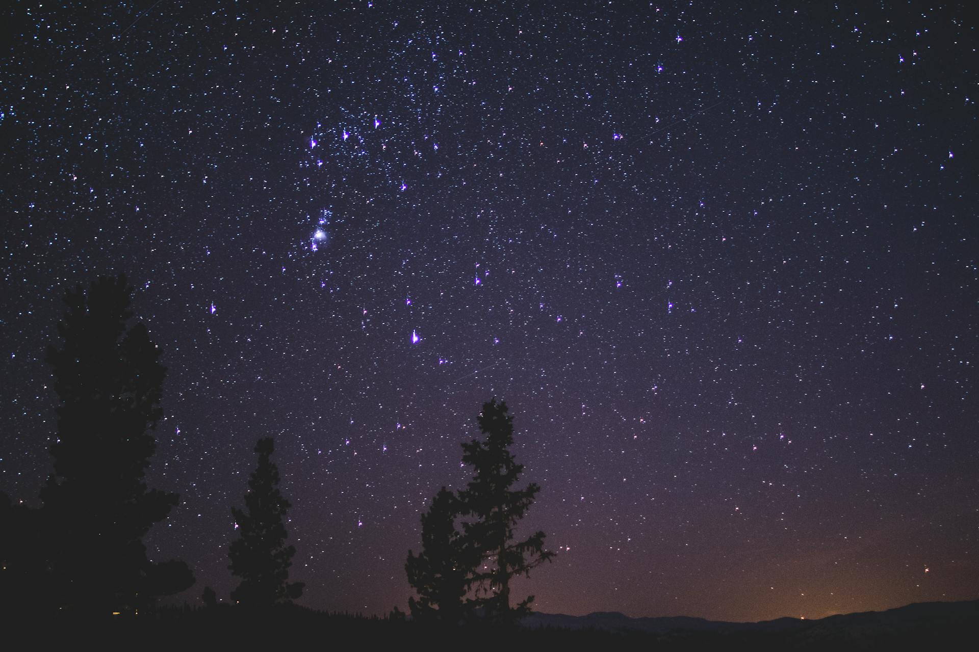 A starlit night sky with constellations connected by faint lines, illustrating the subtle 150 degree tension of a quincunx aspect