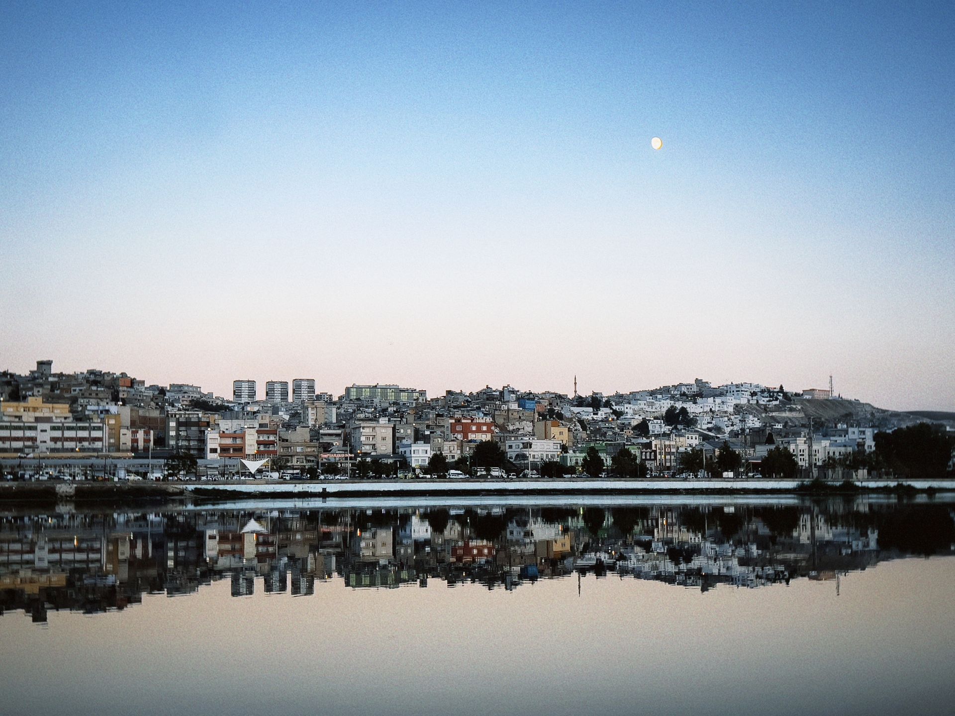 Moonlight reflecting on the still dark surface of water, the natural inspiration behind water scrying