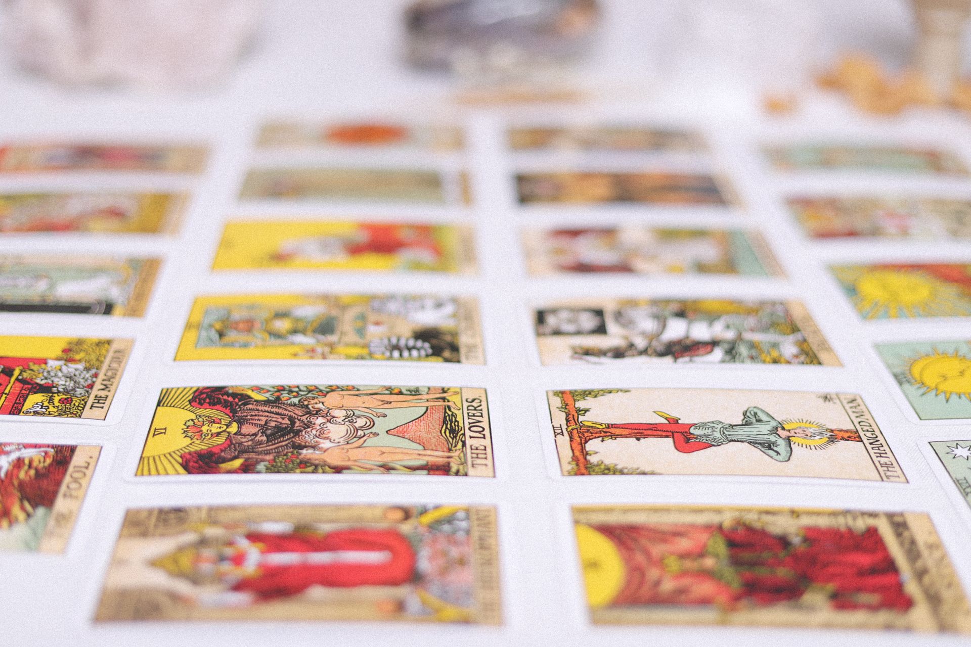 Tarot cards arranged in a structured spread layout on a dark cloth
