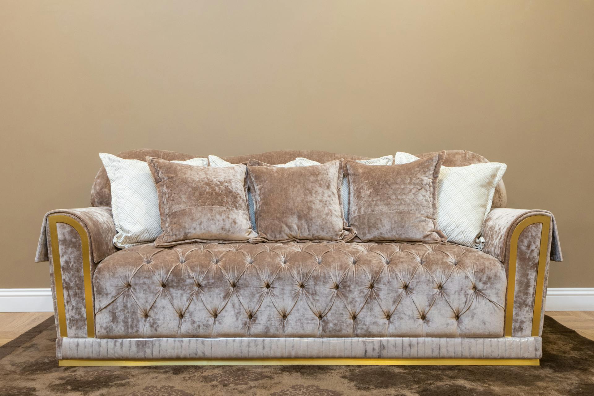 A cozy, beautifully arranged living space with soft textures and warm light, capturing Taurus's love of comfort, beauty, and the senses