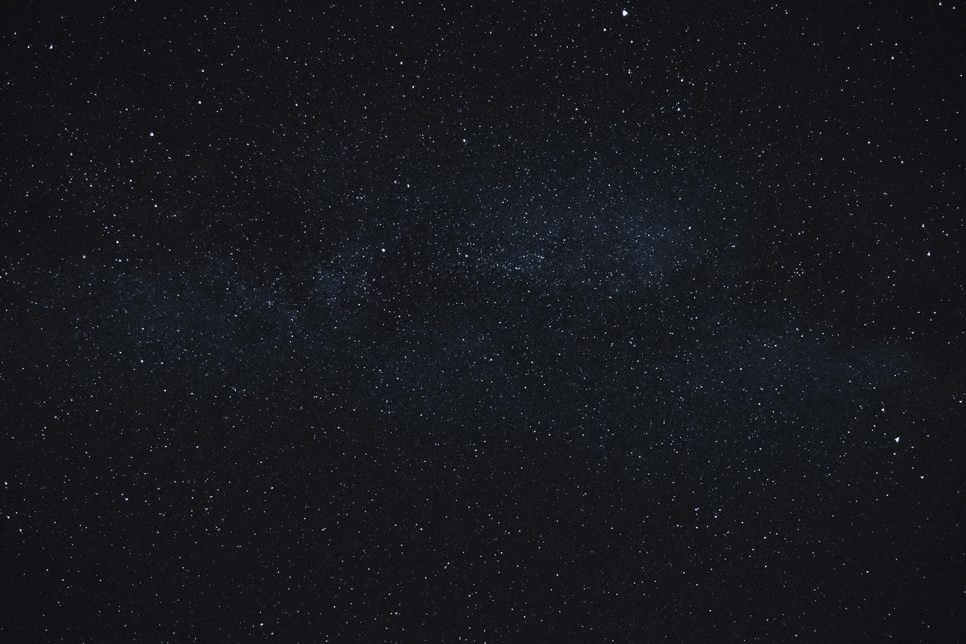 A vast field of stars filling the night sky, representing the restless, far-reaching curiosity of the Uranus in Gemini transit