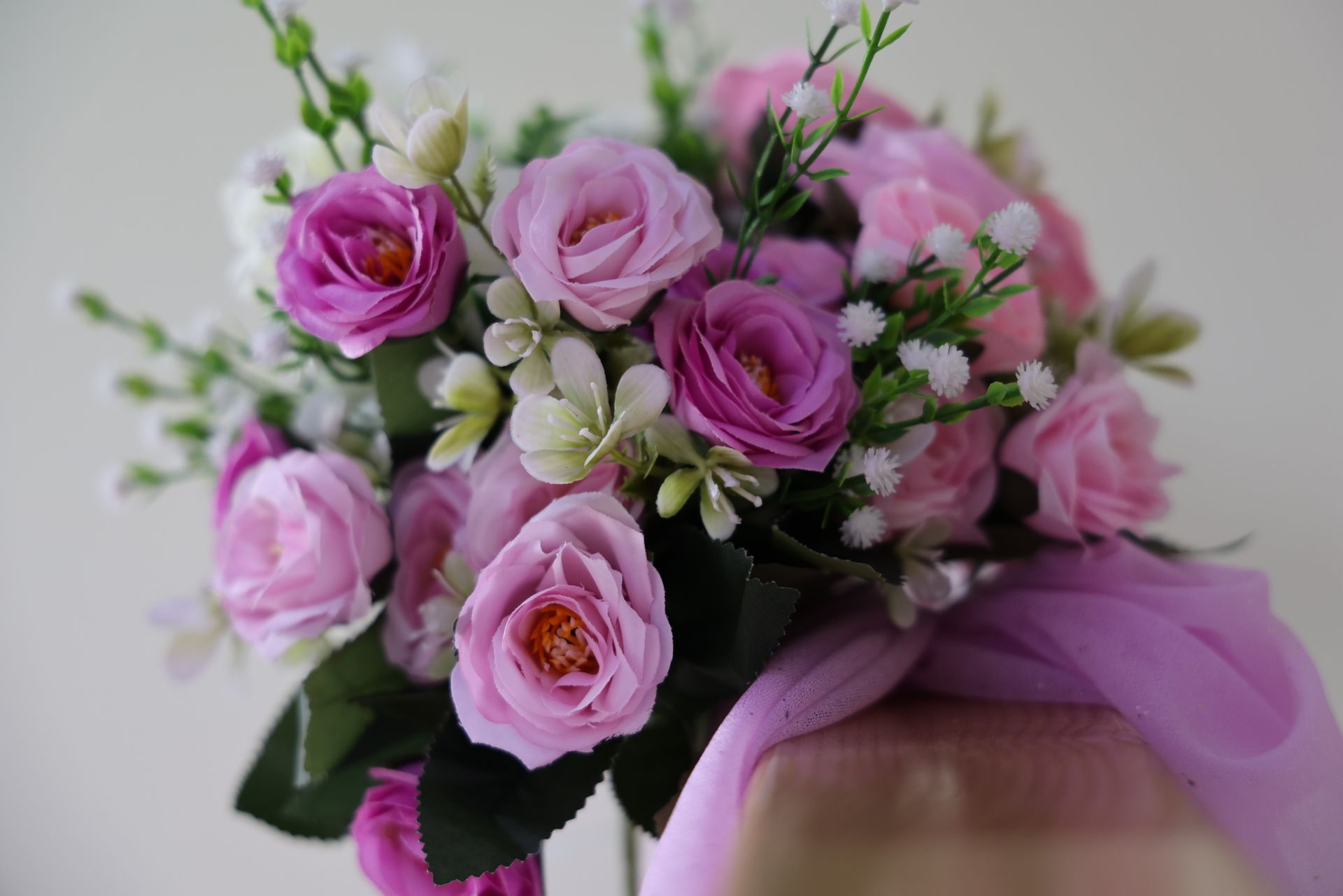 A bouquet of soft pink roses, symbolizing the romance and beauty ruled by Venus