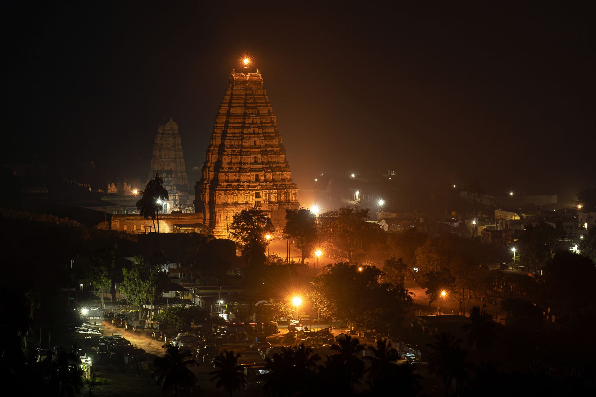 An illuminated Hindu temple at night in Hampi, India, home of the tradition that produced the dasha system