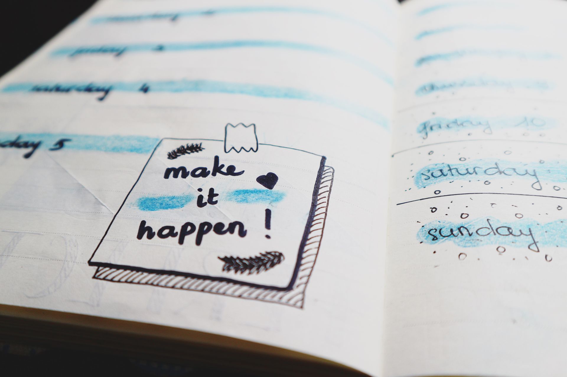 An open planner page with handwritten goals and colorful decorative details, part of building a personal vision board