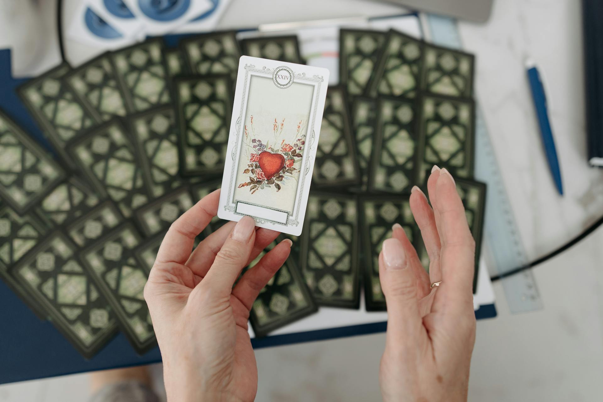 A single tarot card drawn from a spread on a dark cloth, representing a yes or no tarot reading